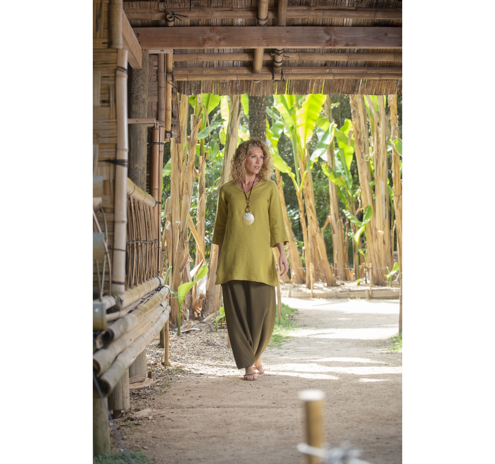 Linden green flax linen INDIE Tunic worn over a green  mixed linen sarouel skirt