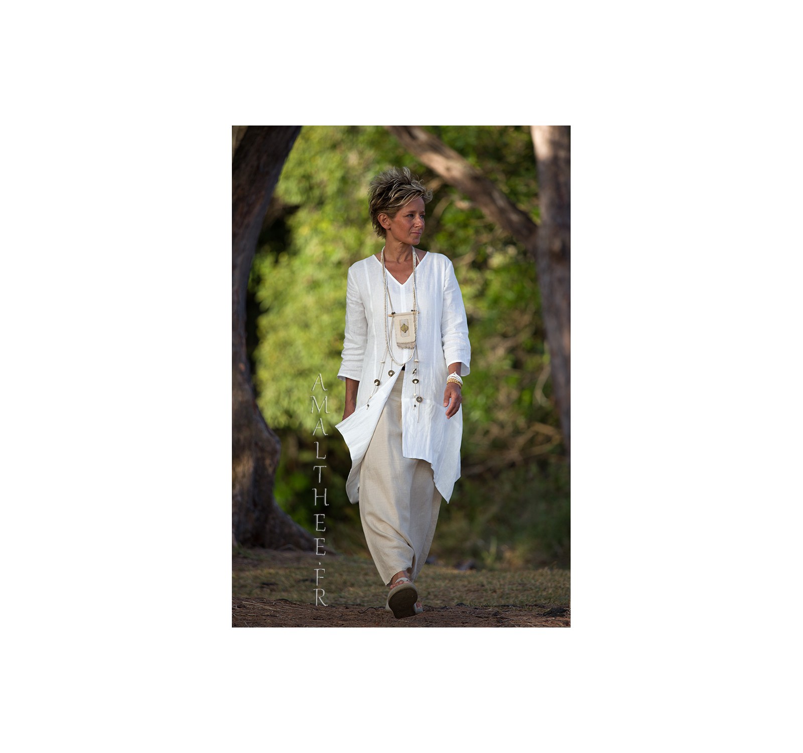 Our natural white linen shirt EmilieTHE must have of this summer!